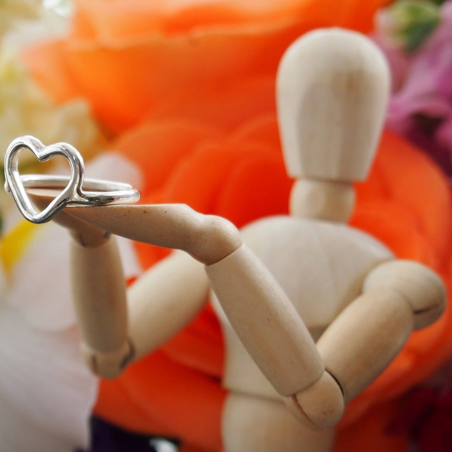 A cutely simple chunky sterling silver wire heart ring.