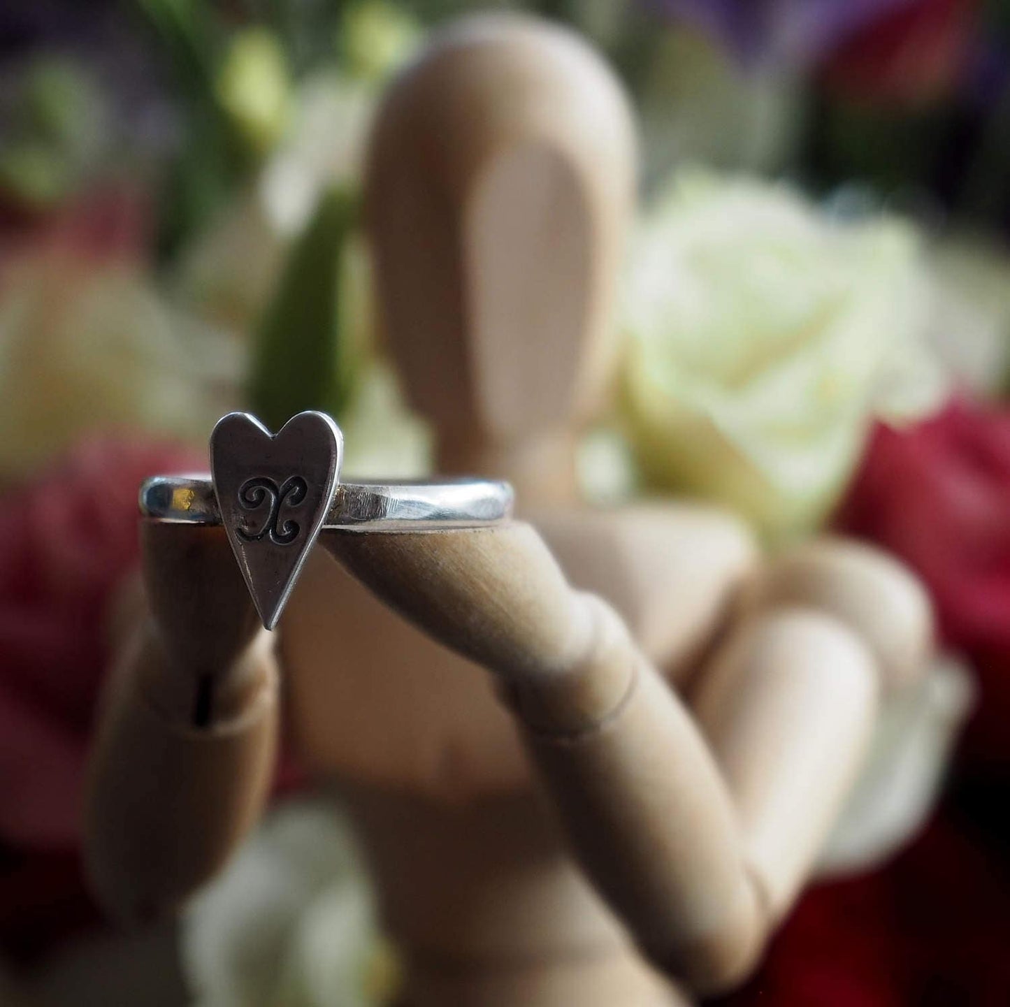 A simple fine silver heart on a beaten sterling silver ring. Sealed with a kiss?