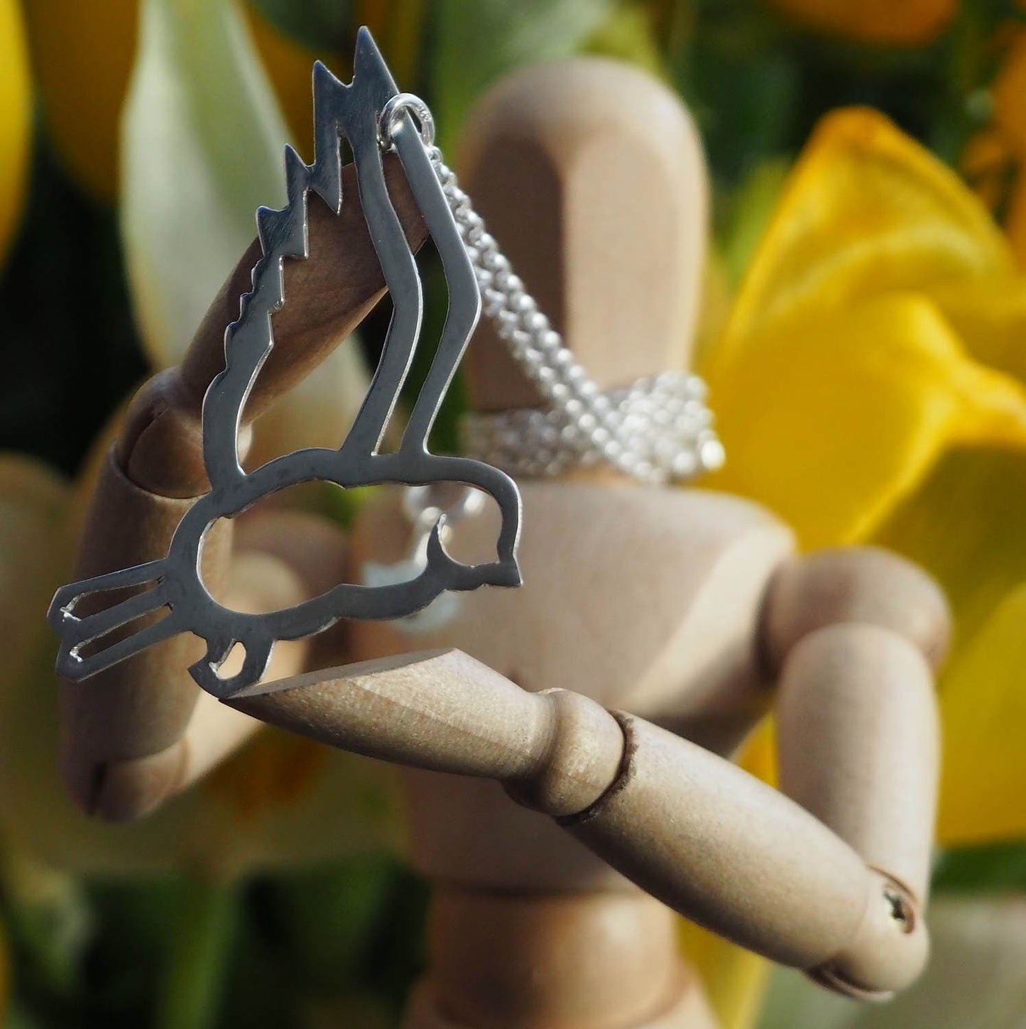 A wonderfully simple unique tattoo style swallow pendant hand cut in recycled sterling silver on a sterling silver chain.