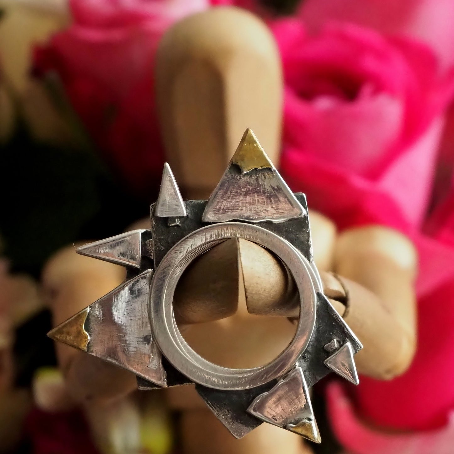 A fantastical set of 3 rings making a mountain scene,  hand made in fine silver with touches of gold