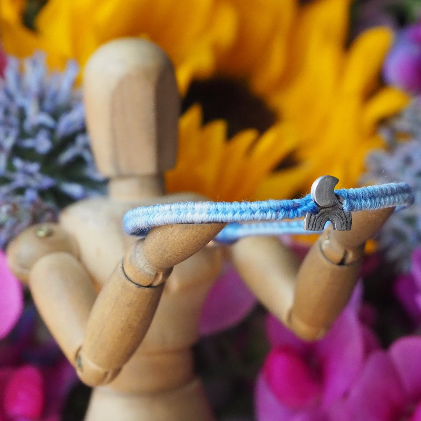 A gorgeous blue fade small sized leather, sterling silver and cotton friendship bracelet with a tiny fine silver moon and rainbow