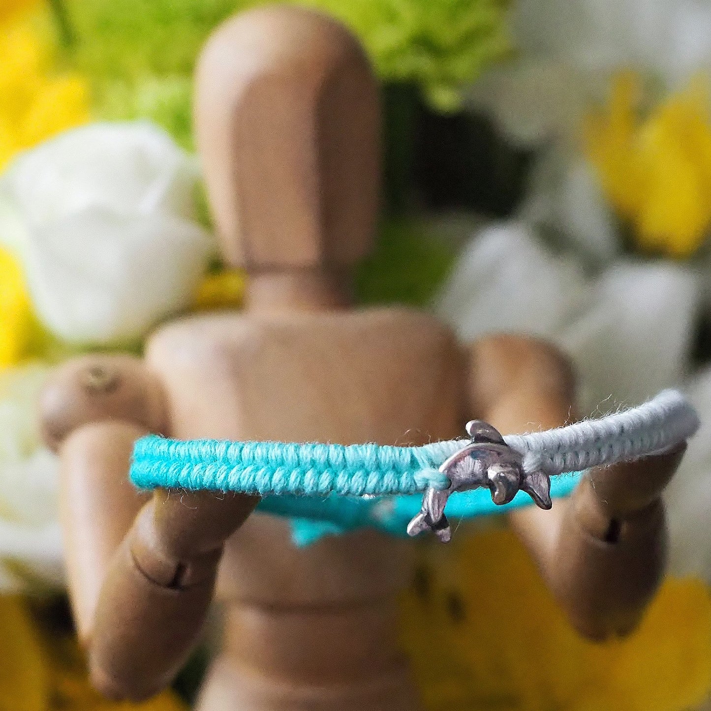 A gorgeous turquoise leather, cotton and sterling silver friendship bracelet with a lovely tiny unique handmade fine silver dolphin.