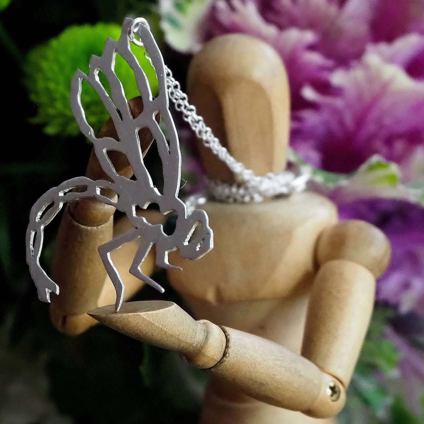 A delightfully simple unique dragonfly pendant hand cut in recycled sterling silver on a sterling silver chain.