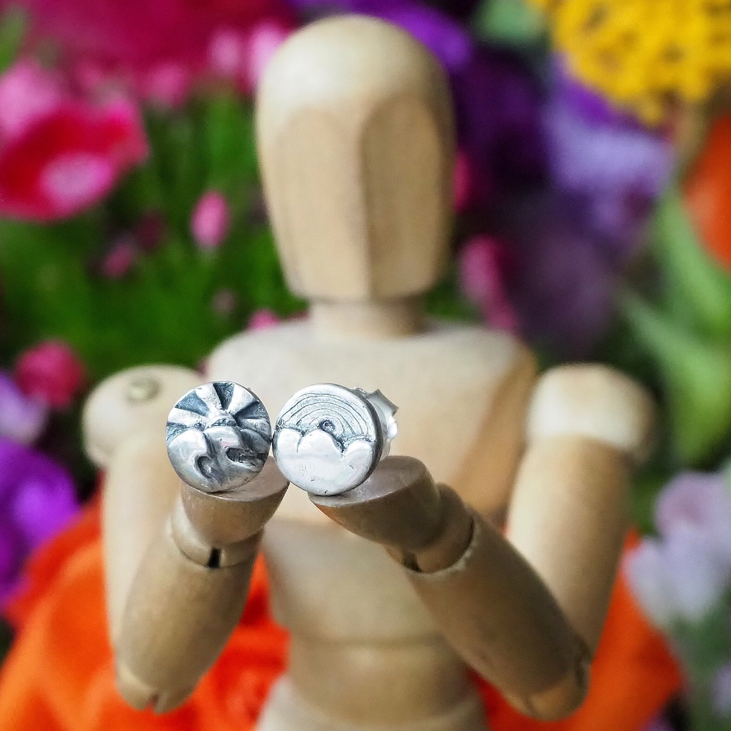 A gorgeous pair of tiny fine landscape stud earrings on sterling silver posts.