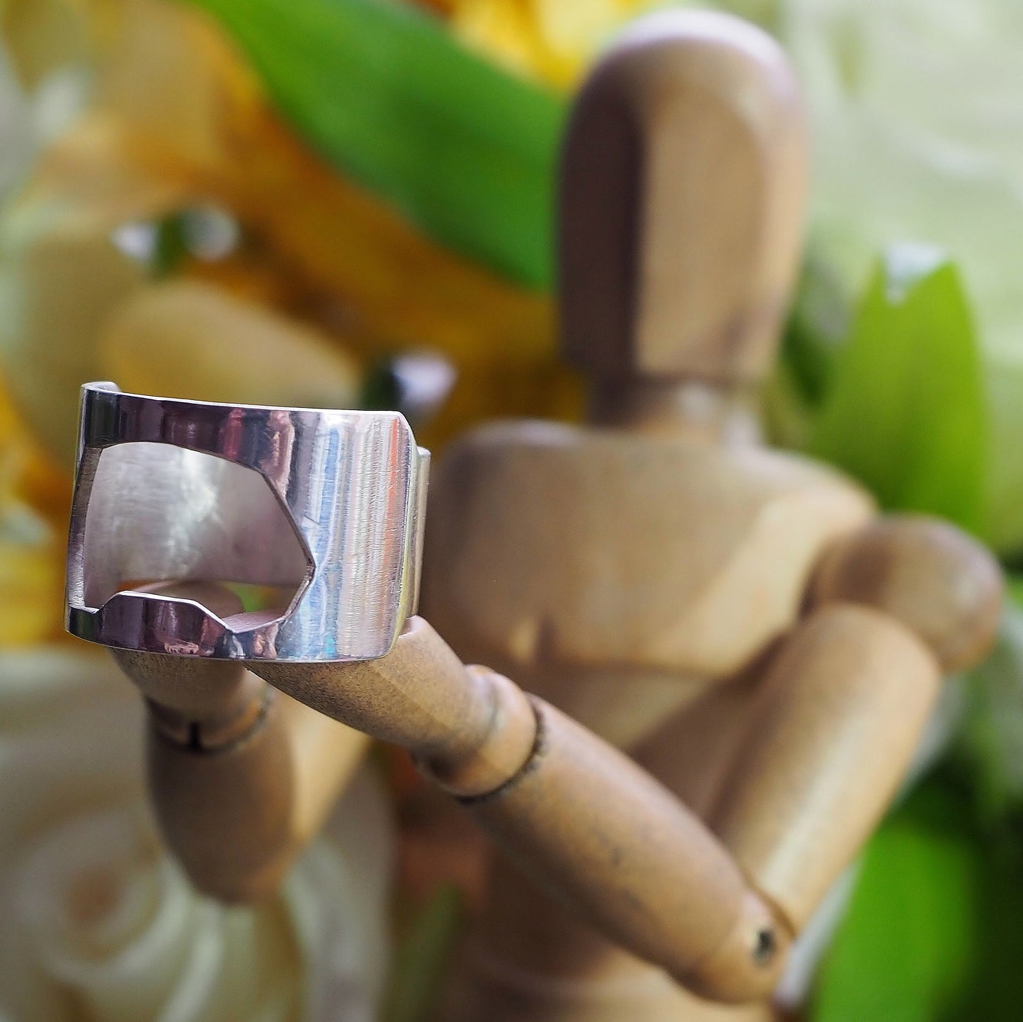 A perfectly simple handmade sterling silver bottle opener ring. Made to order