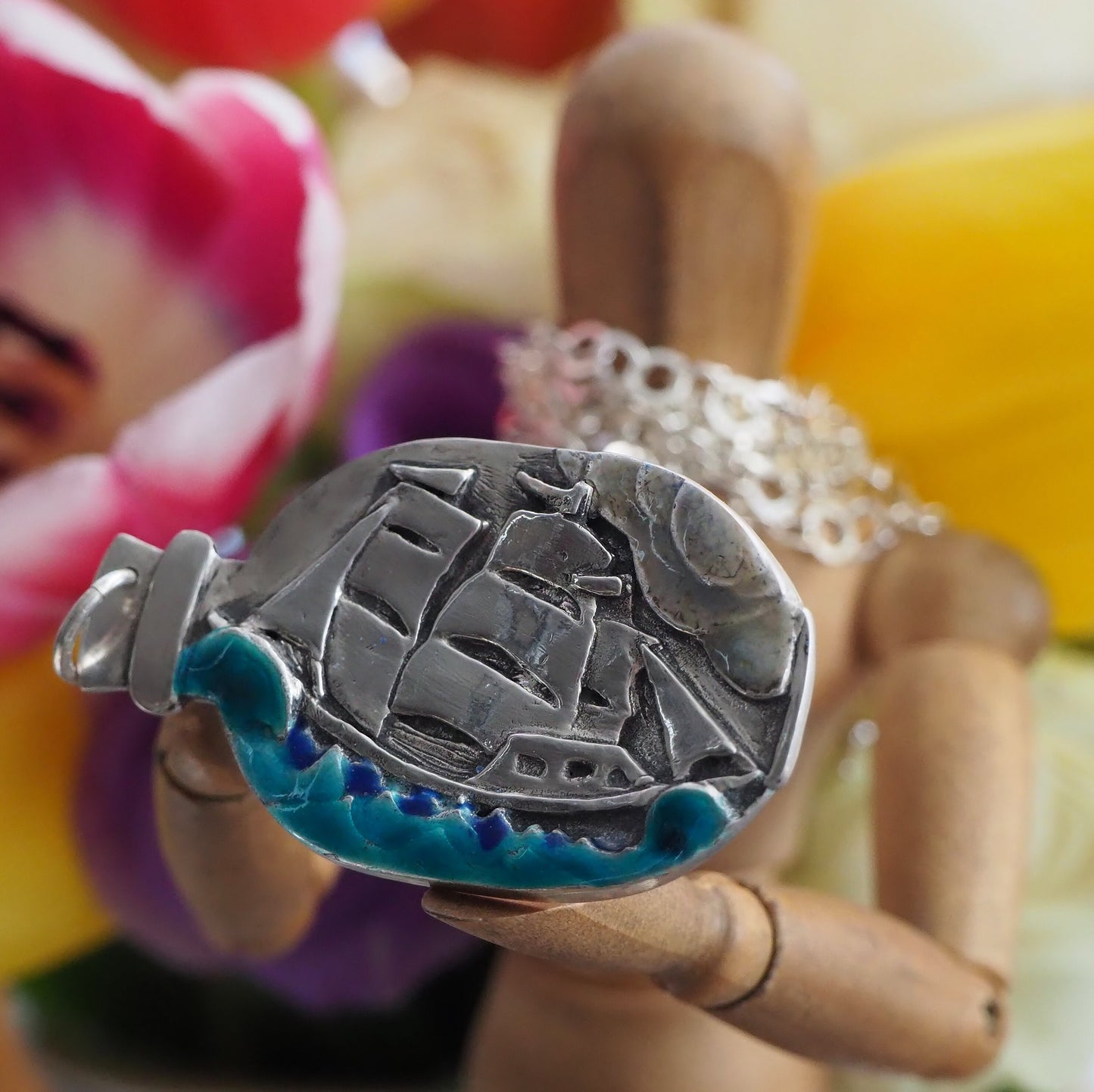 A Beautiful handmade fine silver Ship in a Bottle with gorgeous enamelled sea, a pendant on a long sterling silver chain.