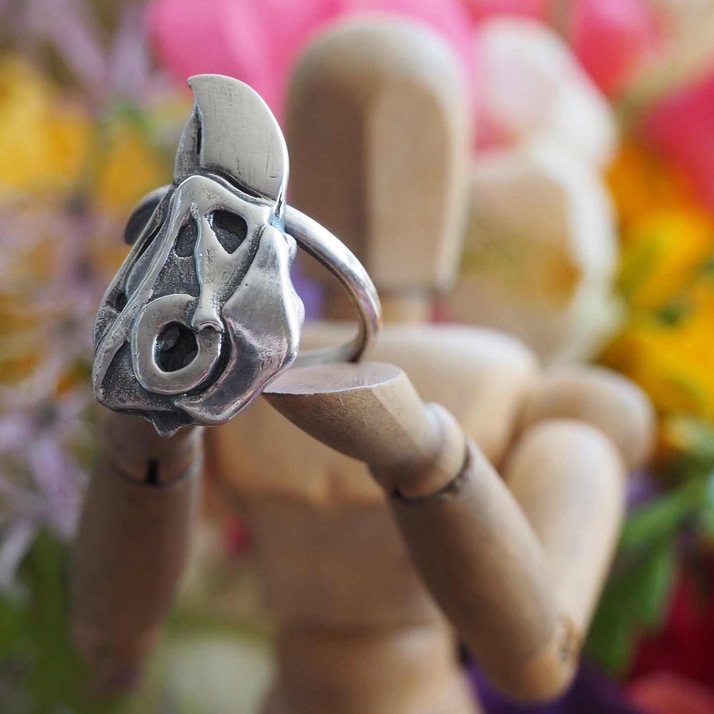 A handmade unique gothic fine silver parrot bird skull adjustable sterling silver ring.