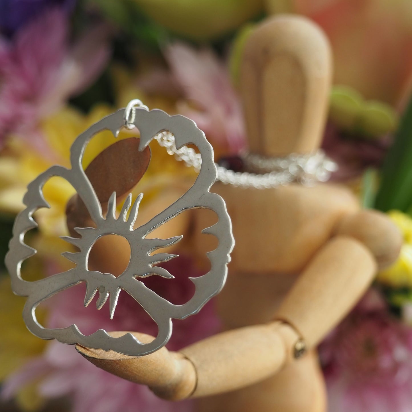 A gorgeously unique flower pendant hand cut in eco sterling silver on a sterling silver chain.