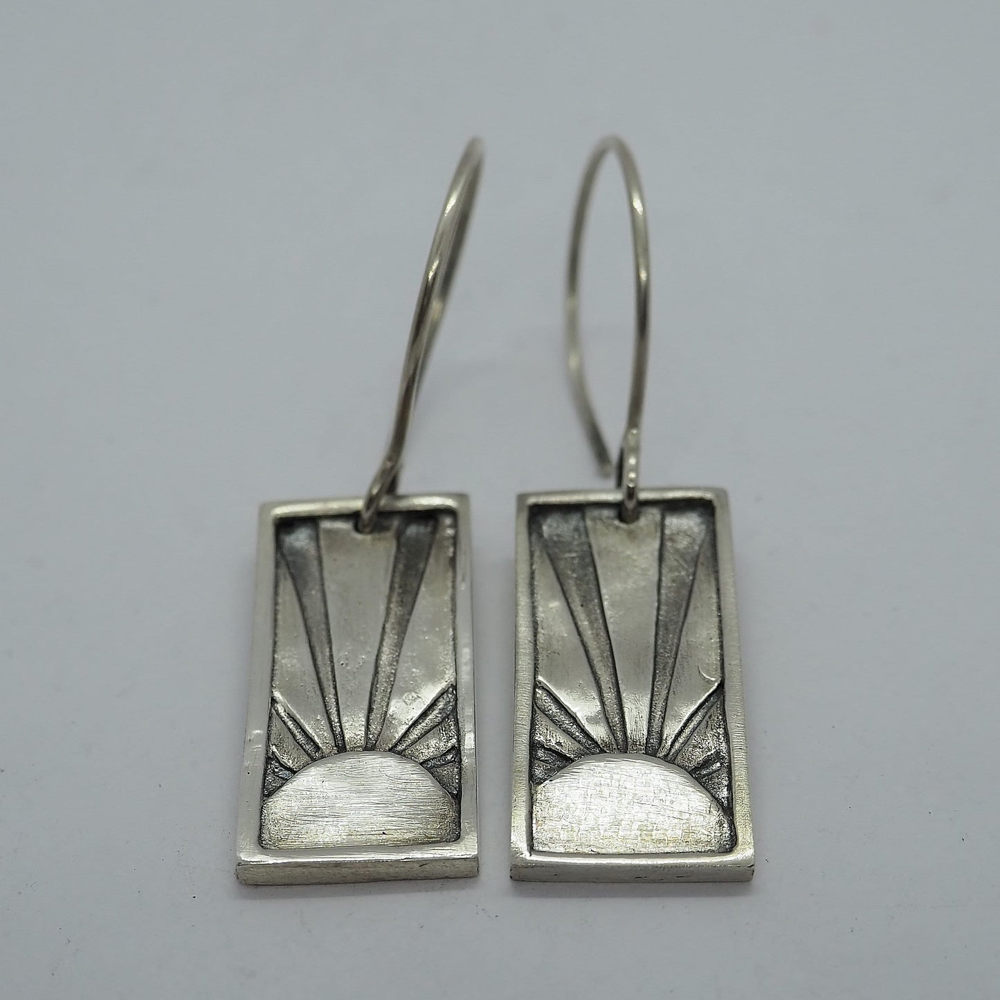 A beautiful art deco style sunset pair of earrings handmade in fine silver on simple sterling silver wires.