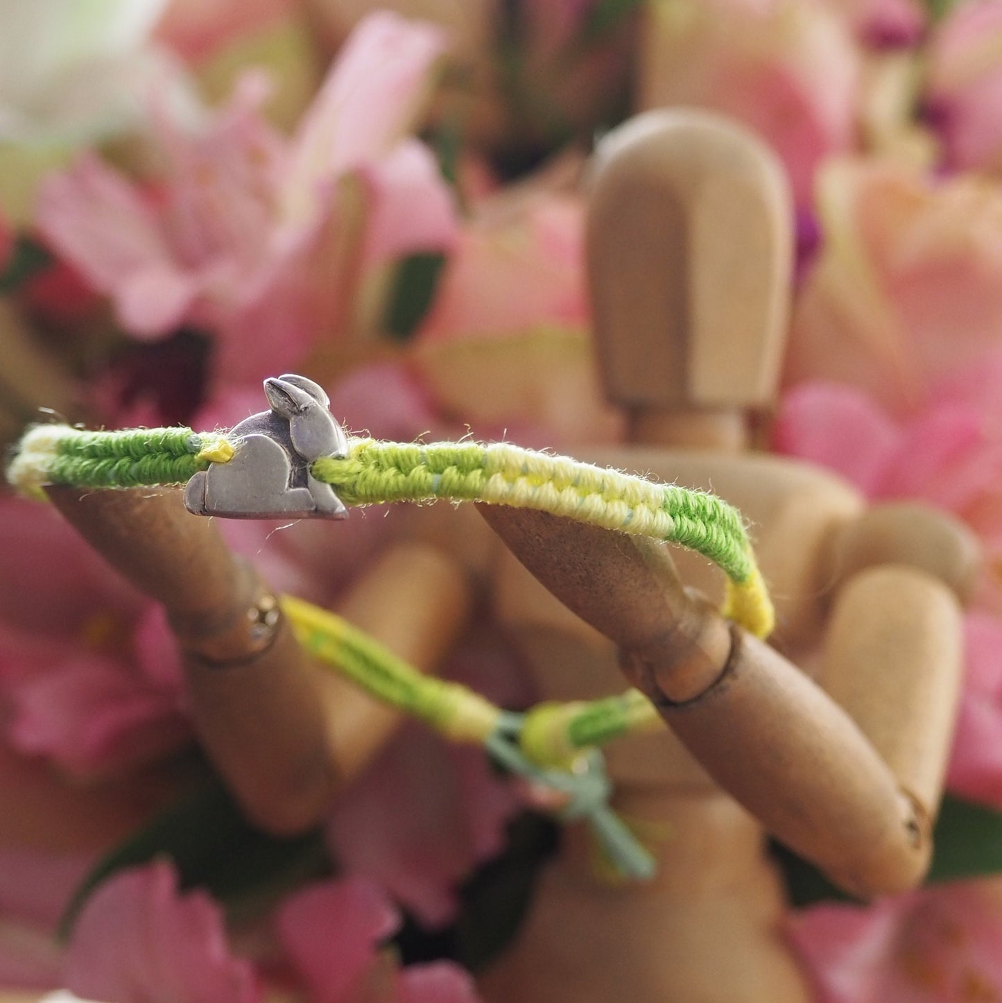 A gorgeous tiny bunny rabbit hand made in fine silver on a beautiful greeny leather, cotton and sterling silver friendship bracelet.