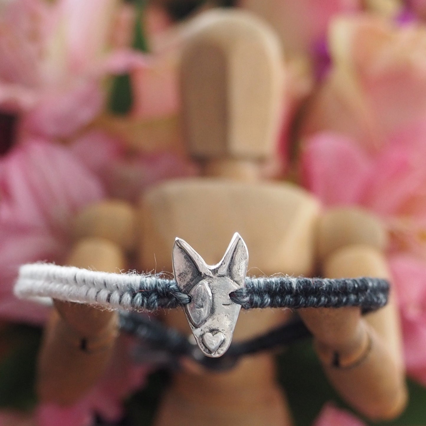 A unique adorable handmade fine silver bull dog on a beautiful grey and black leather, sterling silver and cotton friendship bracelet.