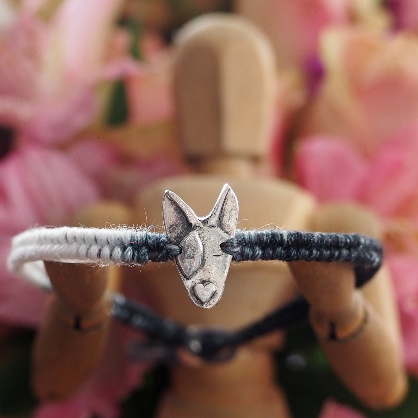 A unique adorable handmade fine silver bull dog on a beautiful grey and black leather, sterling silver and cotton friendship bracelet.