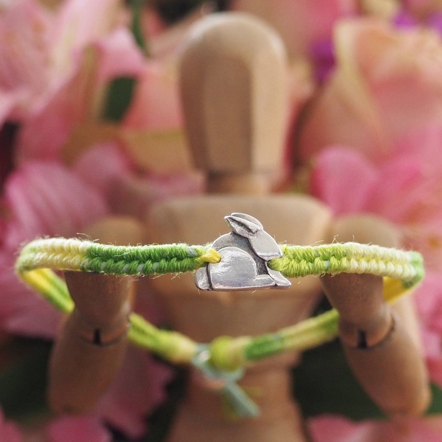 A gorgeous tiny bunny rabbit hand made in fine silver on a beautiful greeny leather, cotton and sterling silver friendship bracelet.