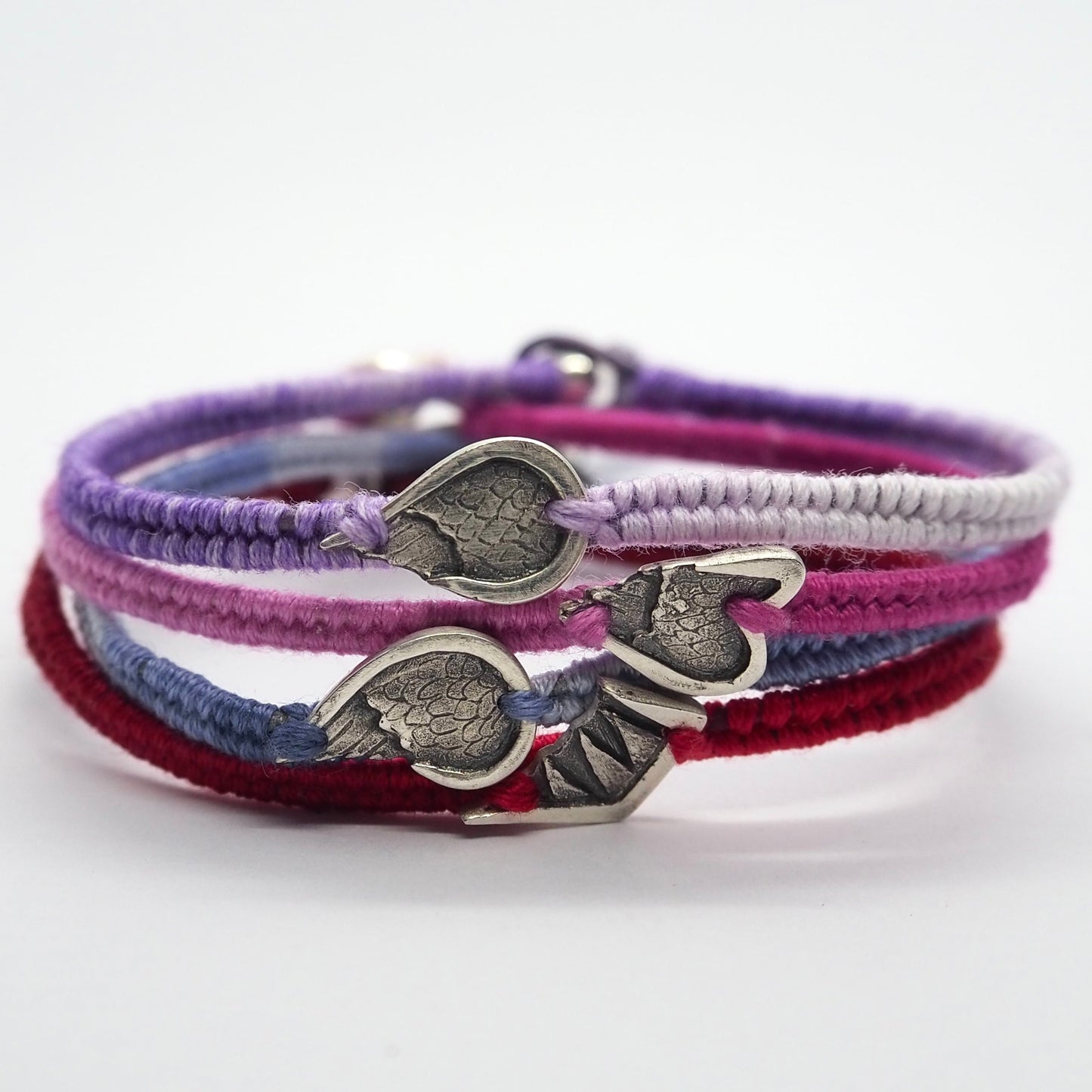 A gorgeous deep blue leather, cotton and sterling silver friendship bracelet with a lovely handmade fine silver angel wing.