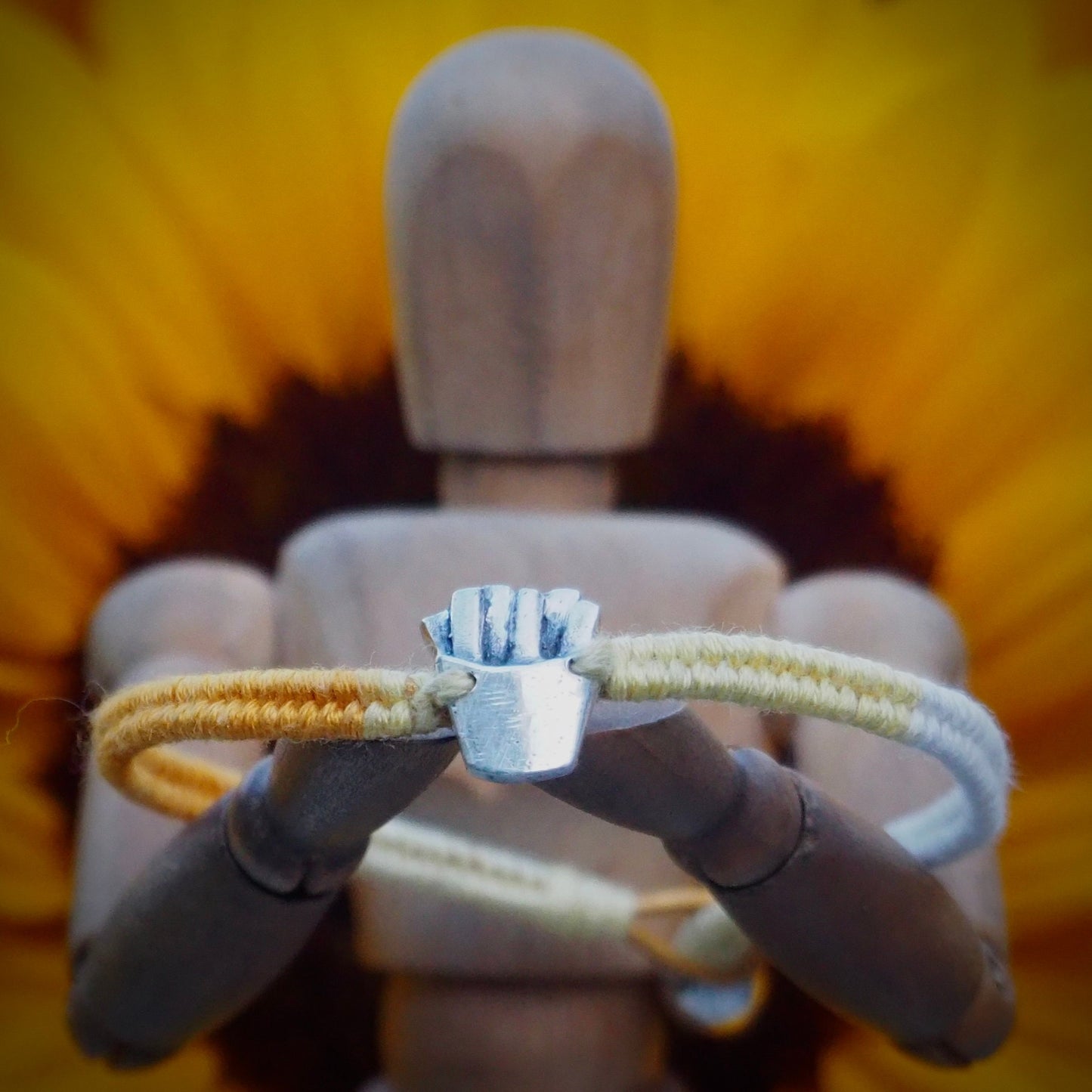 A unique tiny fine silver portion of fries on a beautiful yellow leather, sterling silver and cotton friendship bracelet.
