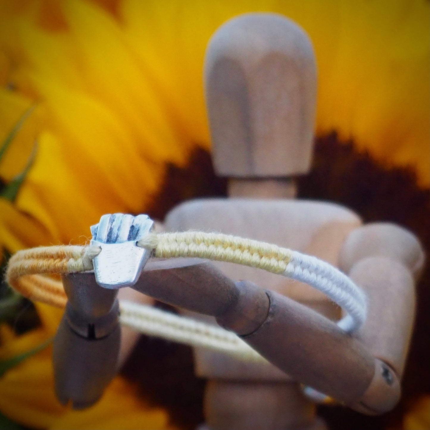 A unique tiny fine silver portion of fries on a beautiful yellow leather, sterling silver and cotton friendship bracelet.