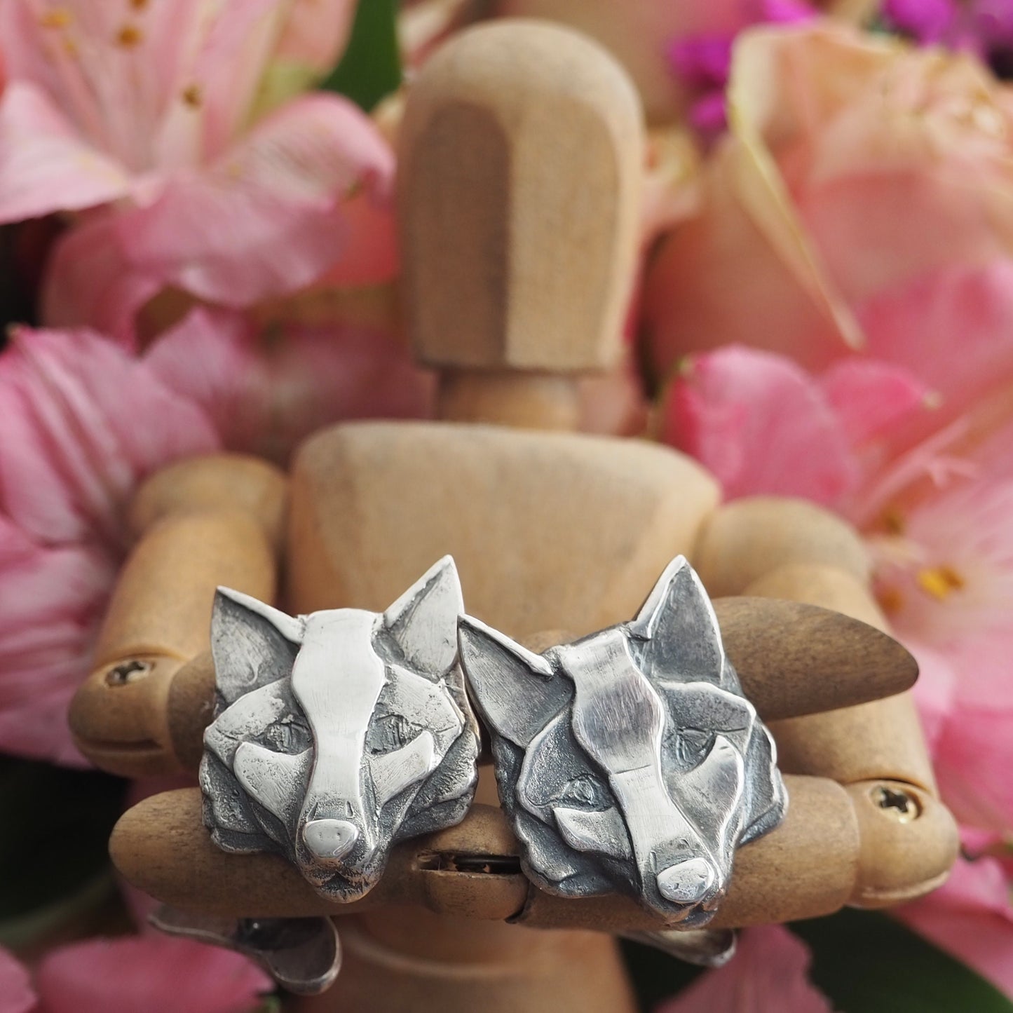 A gorgeous pair of fox head cufflinks hand made in fine silver, secured with sterling silver chain and a foxes brush on the back.
