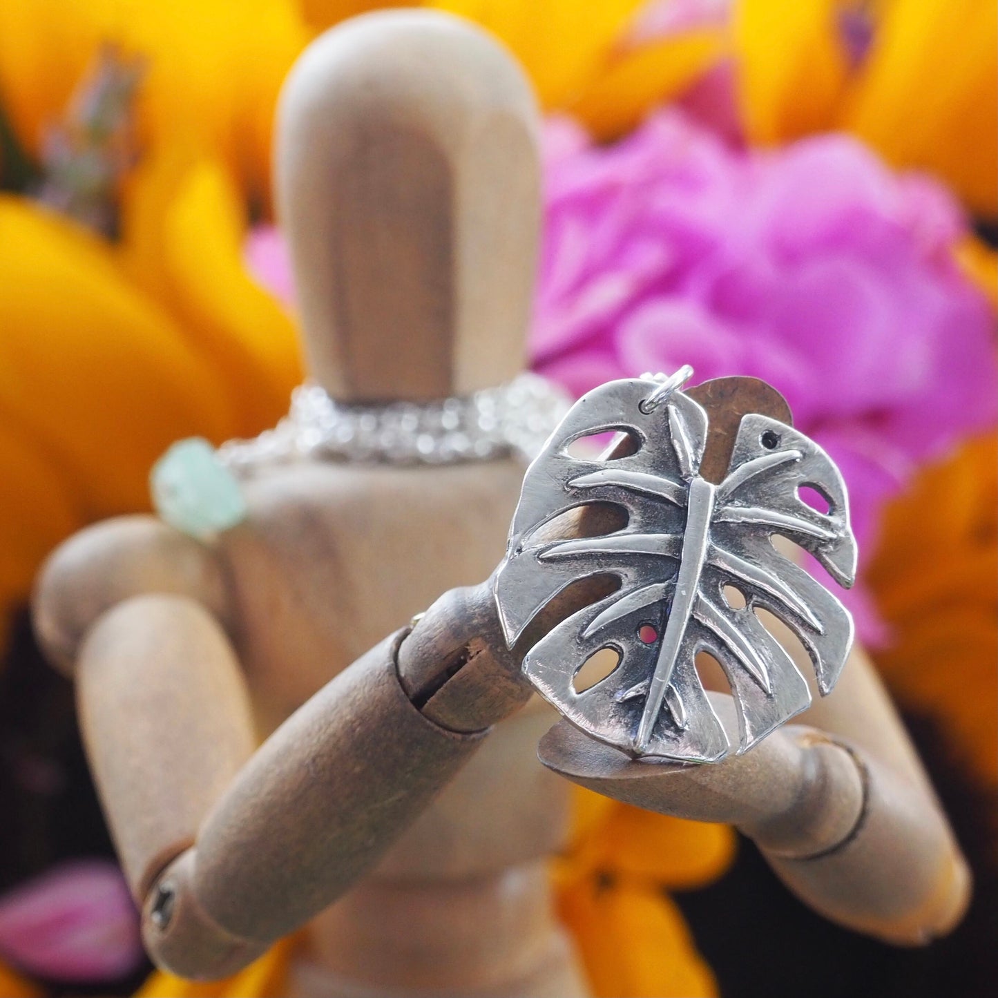 A gorgeous unique small size monstera leaf handmade in eco friendly fine silver on a sterling silver necklace.