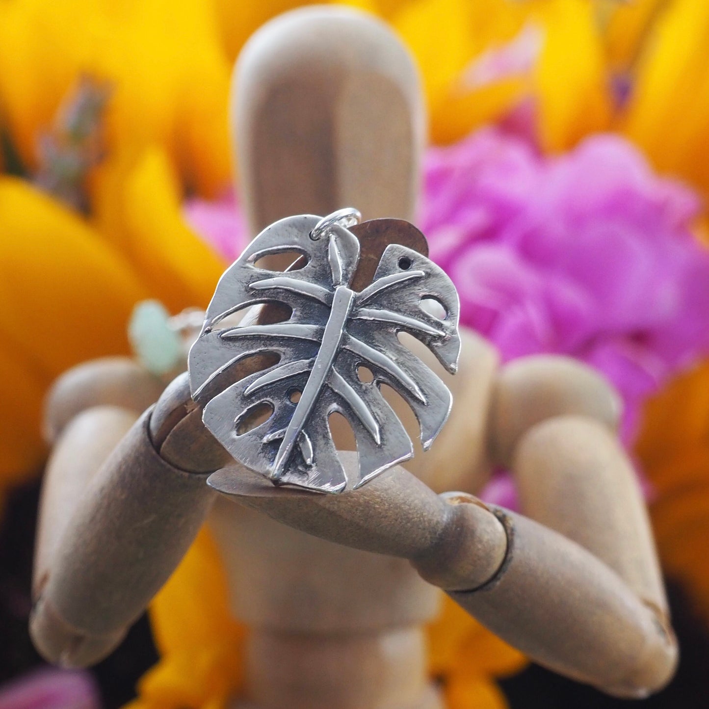 A gorgeous unique small size monstera leaf handmade in eco friendly fine silver on a sterling silver necklace.
