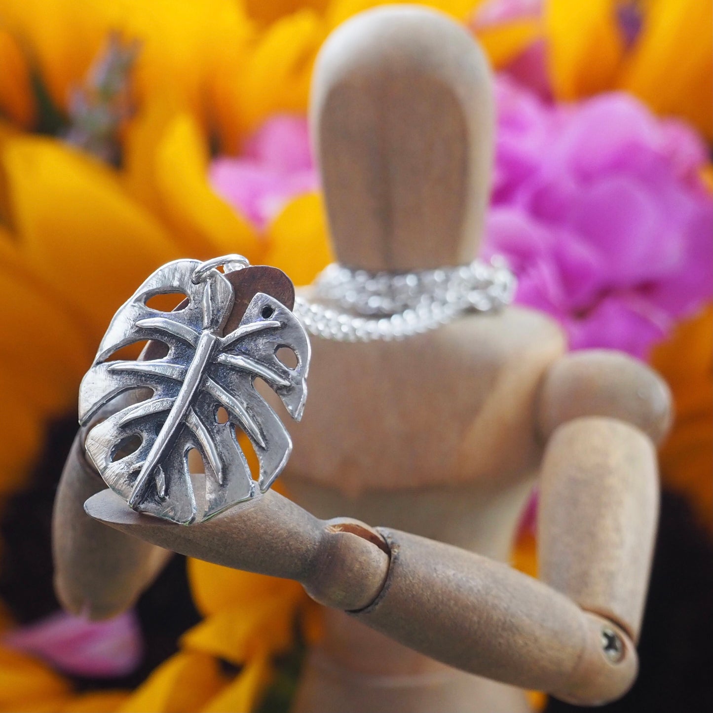 A gorgeous unique small size monstera leaf handmade in eco friendly fine silver on a sterling silver necklace.