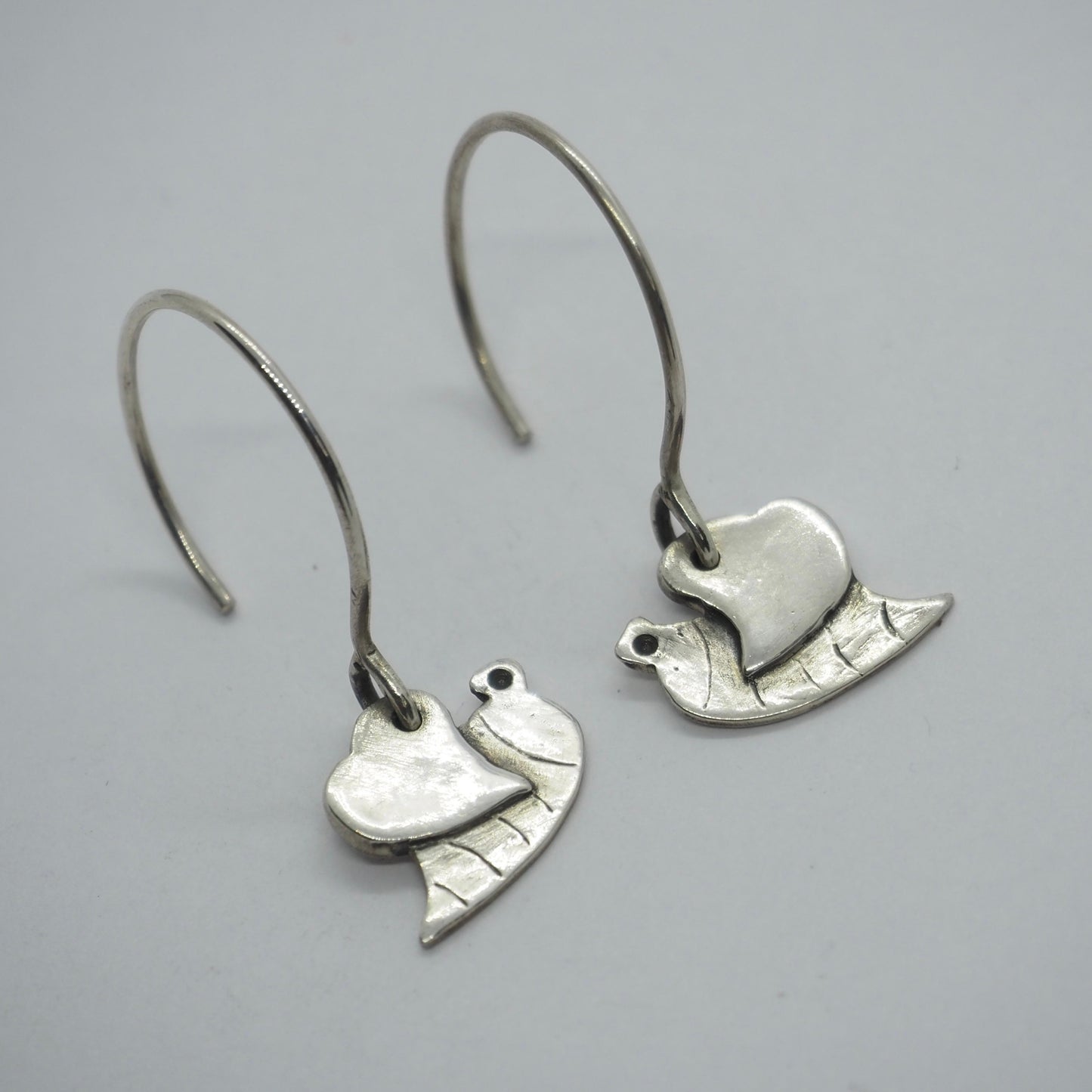 An adorable pair of fine silver little bumble bee earrings on sterling silver wires.