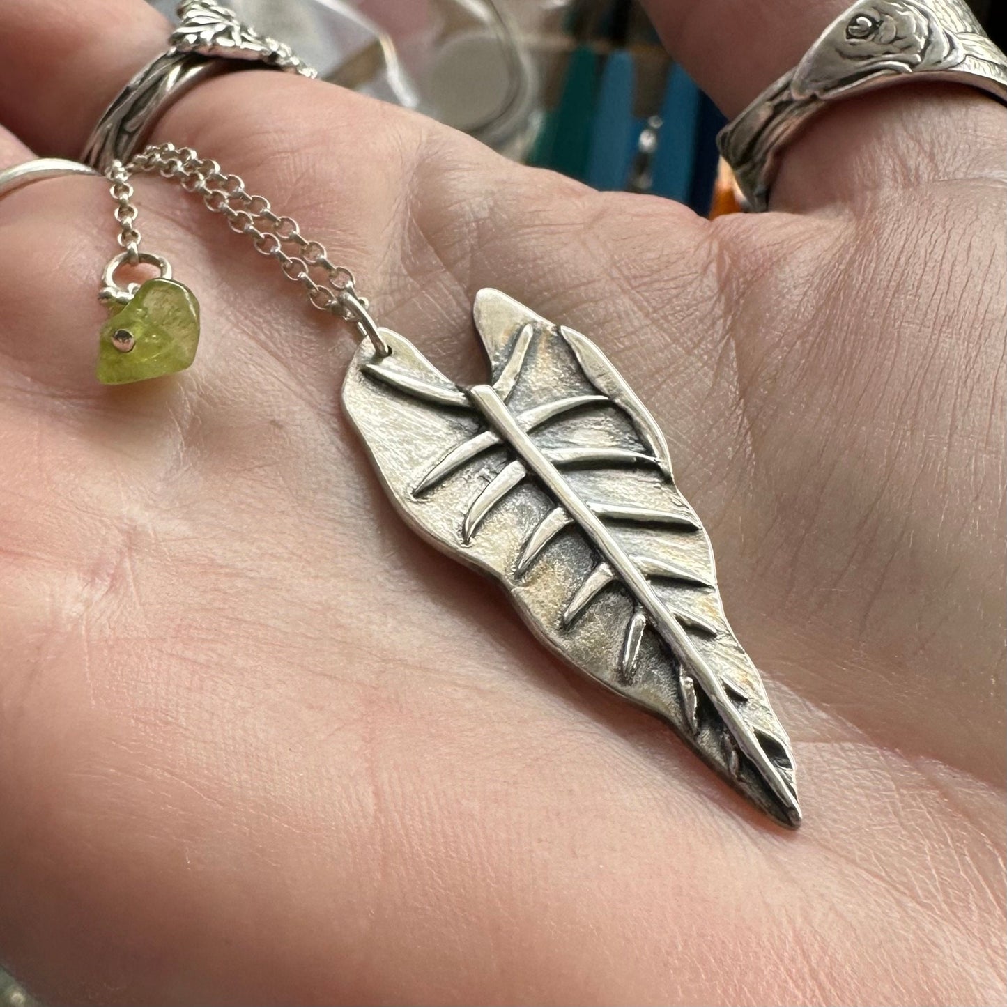 A gorgeous unique philodendron leaf handmade in eco friendly fine silver on a sterling silver necklace.