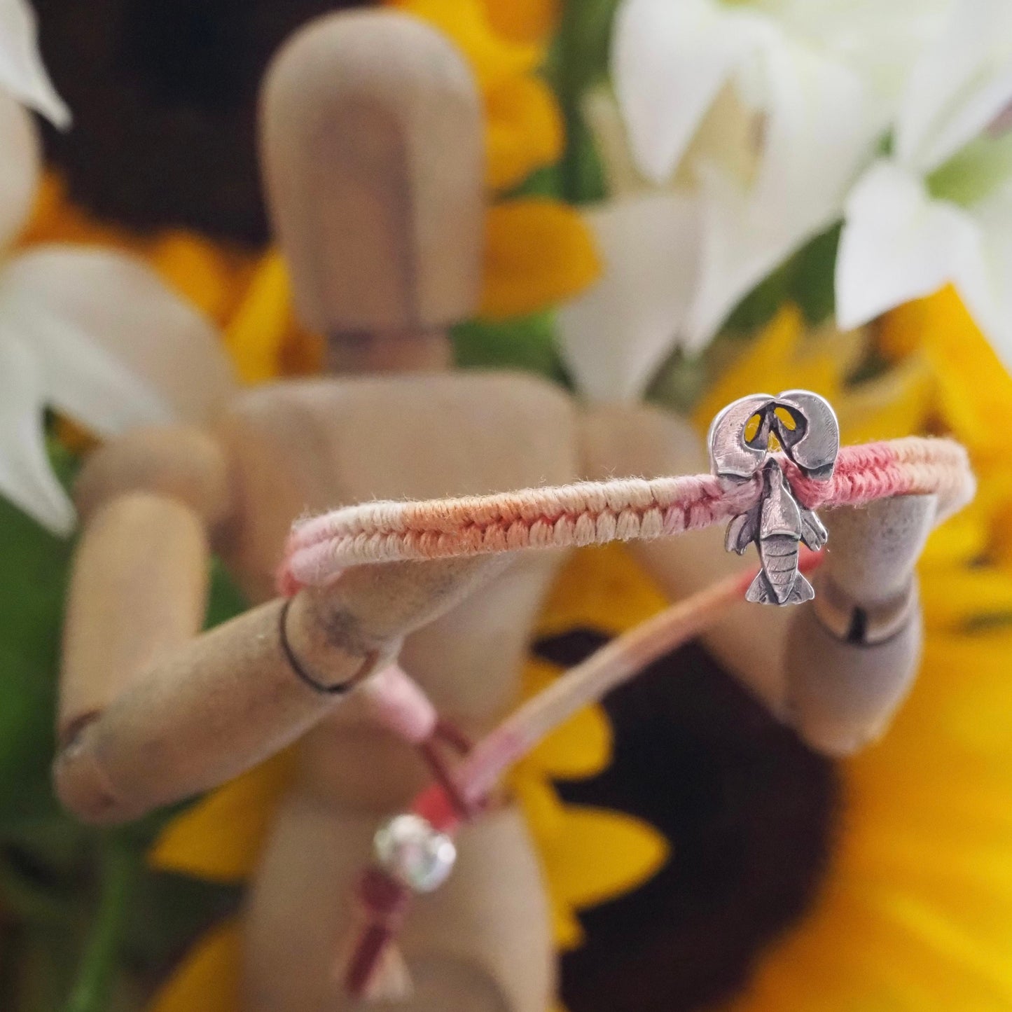 A beautiful tiny lobster handmade in fine silver on a peachy pinks leather, sterling silver and cotton friendship bracelet…