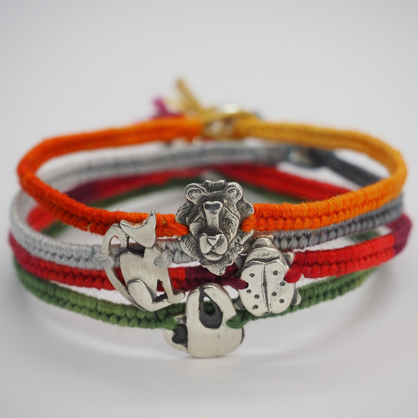 A lovely tiny handmade fine silver ladybird on pinky red leather, cotton and sterling silver friendship bracelet…