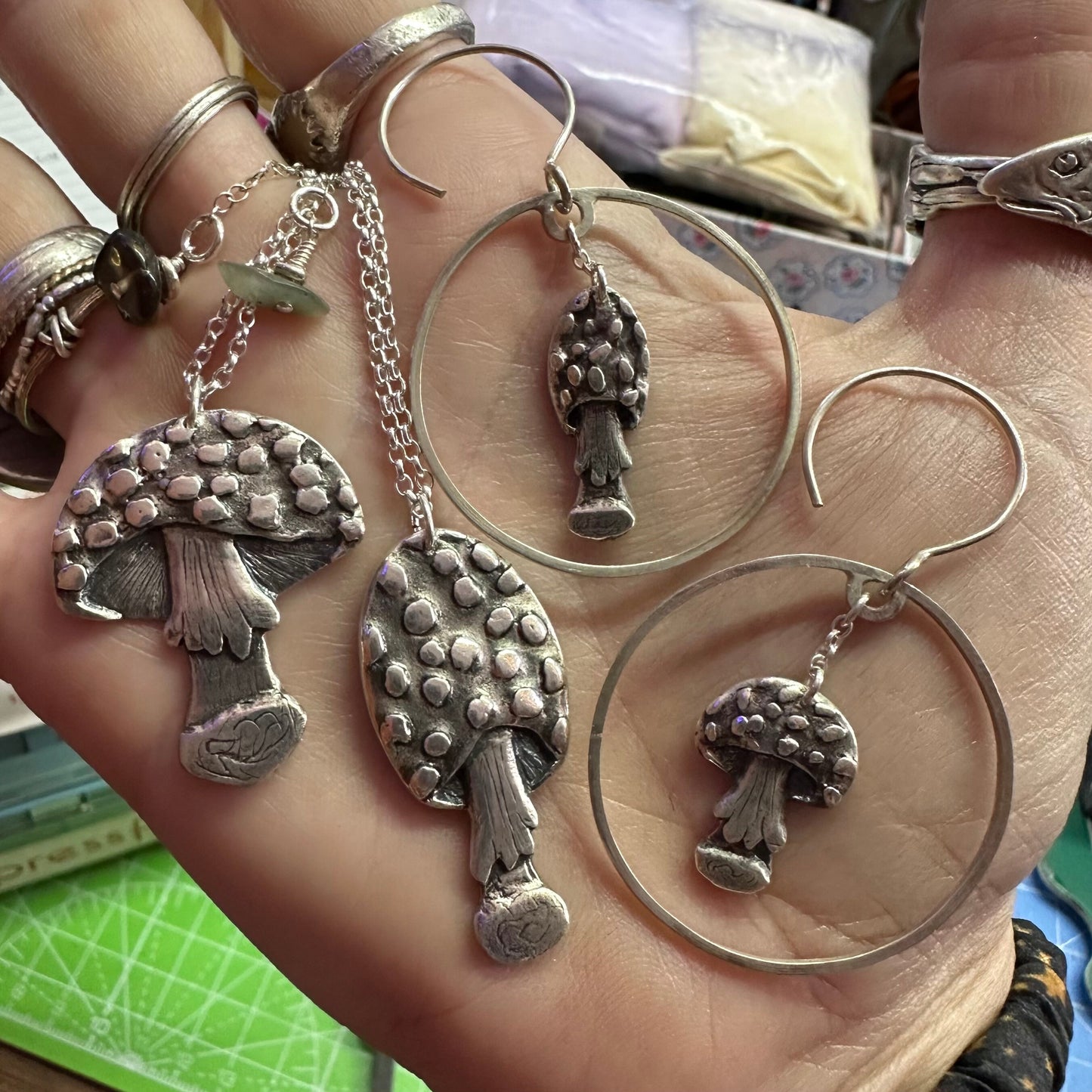 A gorgeous pair of toadstool earrings handmade in fine silver and hung on large handmade sterling silver hoops and wires…