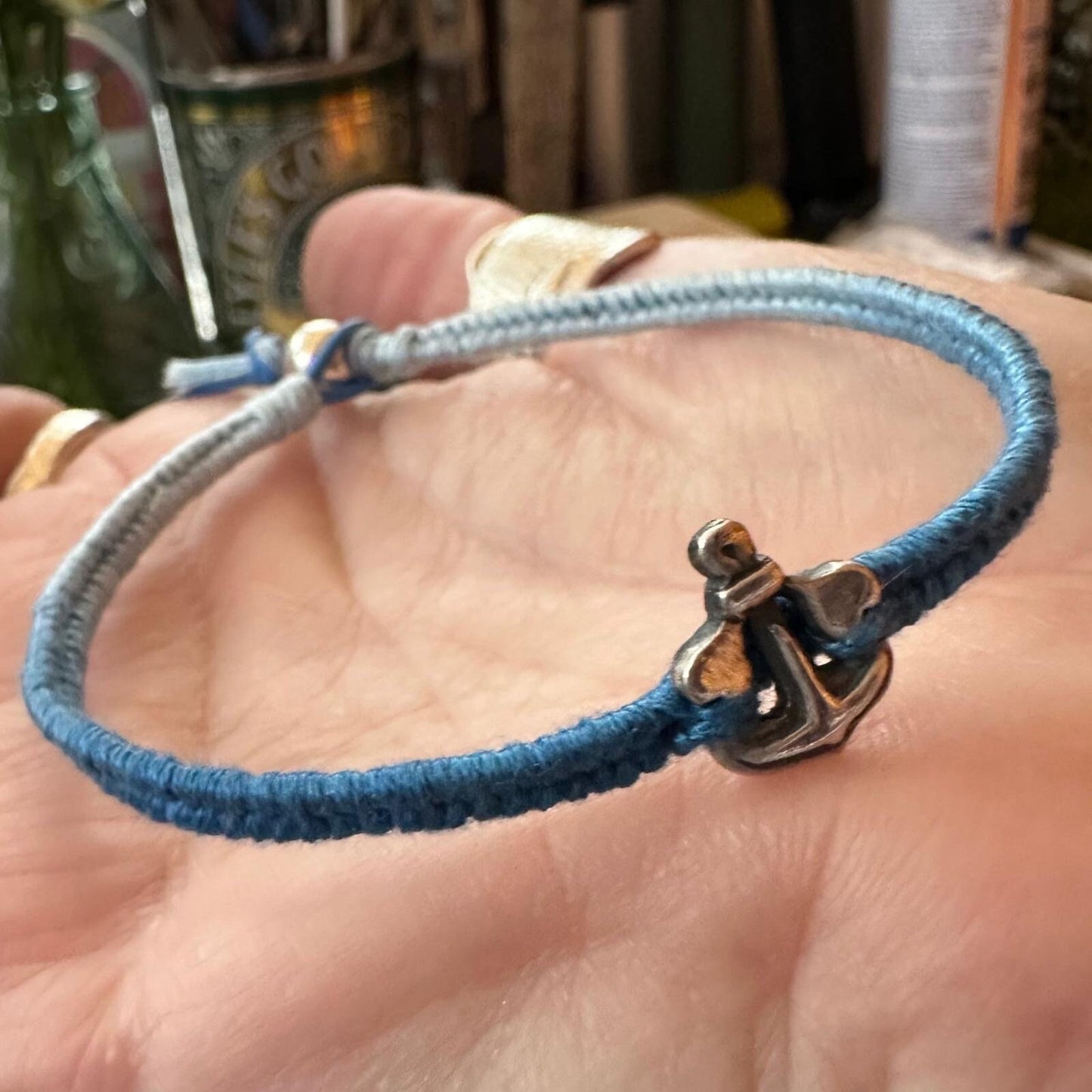 A lovely tiny unique fine silver anchor on a gorgeous soft blue leather, cotton and sterling silver friendship bracelet.