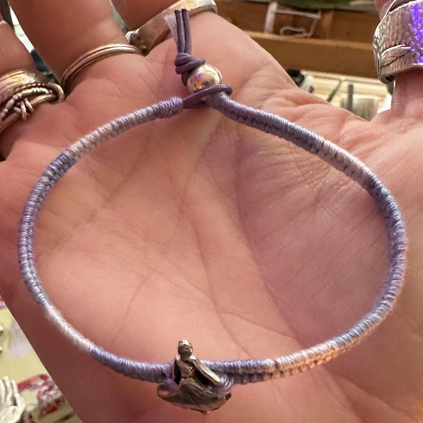 A gorgeous fine ballet silver dancer on a pretty lilac faded leather, cotton and sterling silver woven charm bracelet.