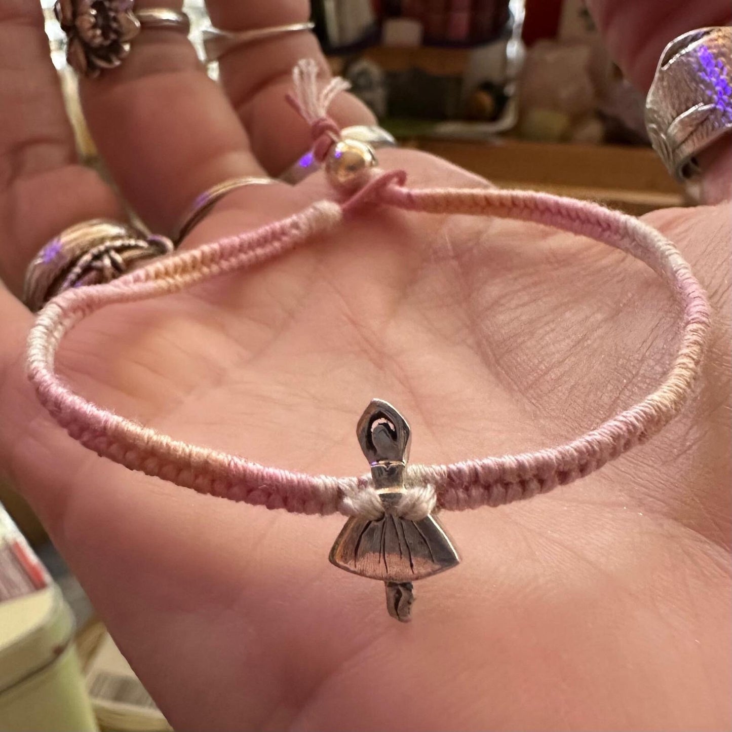 A beautiful solo ballet dancer handmade in fine silver on a baby pinks leather, sterling silver and cotton friendship bracelet…
