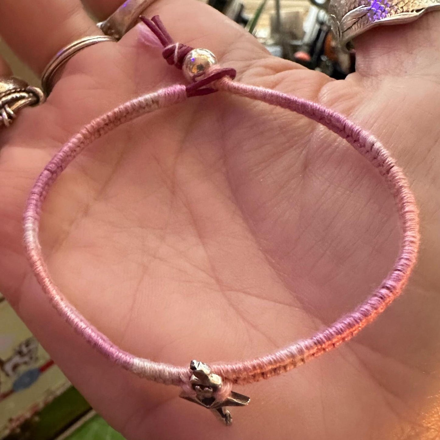 A beautiful tutu wearing ballet dancer handmade in fine silver on a soft pinks leather, sterling silver and cotton woven charm bracelet…