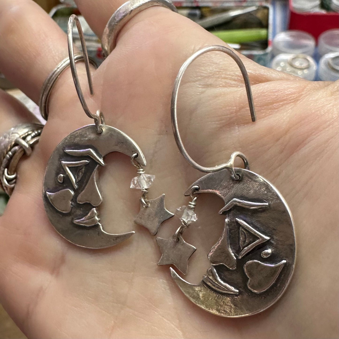 A gorgeous pair of handmade fine silver moon and sun/star earrings on sterling silver wires embellished with Herkimer diamonds.