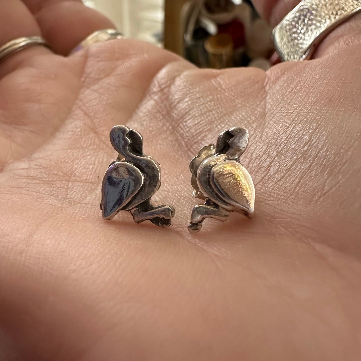 A beautiful pair of simple flamingo stud earrings handmade in fine silver with sterling silver posts.