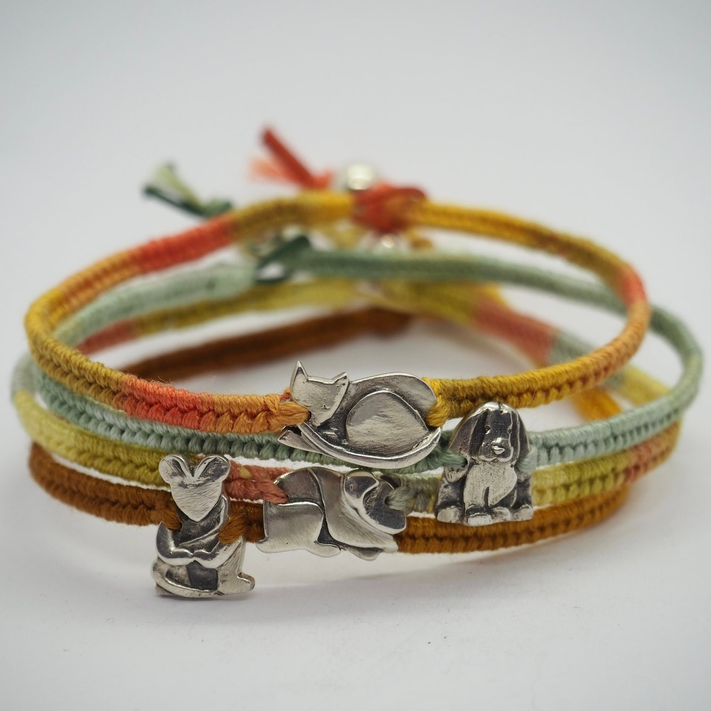 A unique tiny cute fine silver mouse on a beautiful soft yellow leather, sterling silver and cotton friendship bracelet.