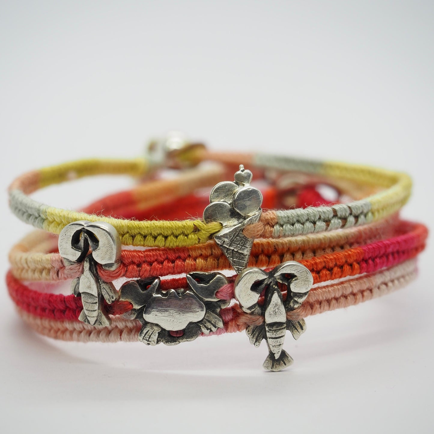 A beautiful tiny lobster handmade in fine silver on a peachy pinks leather, sterling silver and cotton friendship bracelet…