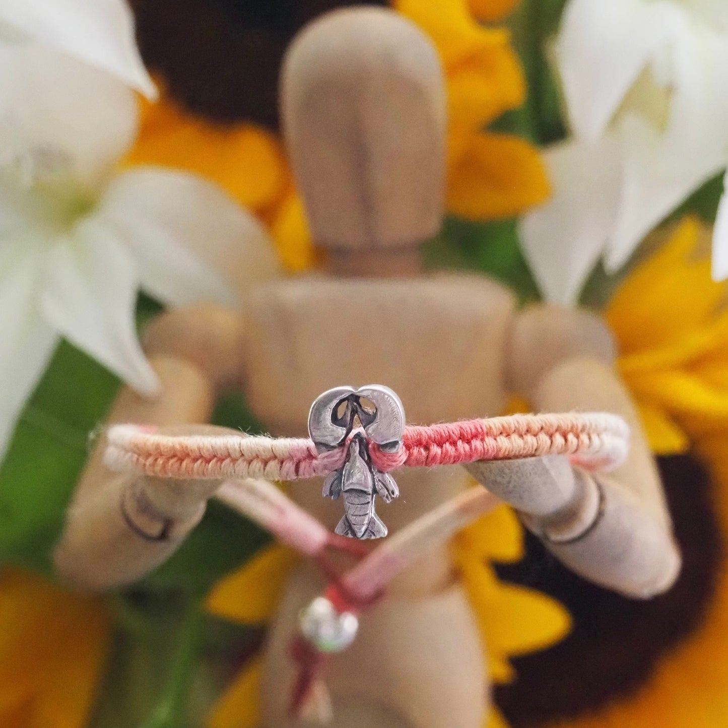 A beautiful tiny lobster handmade in fine silver on a peachy pinks leather, sterling silver and cotton friendship bracelet…