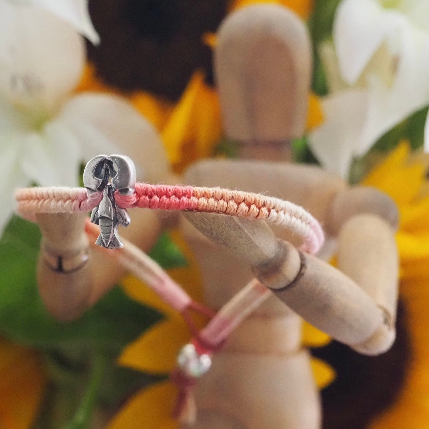 A beautiful tiny lobster handmade in fine silver on a peachy pinks leather, sterling silver and cotton friendship bracelet…