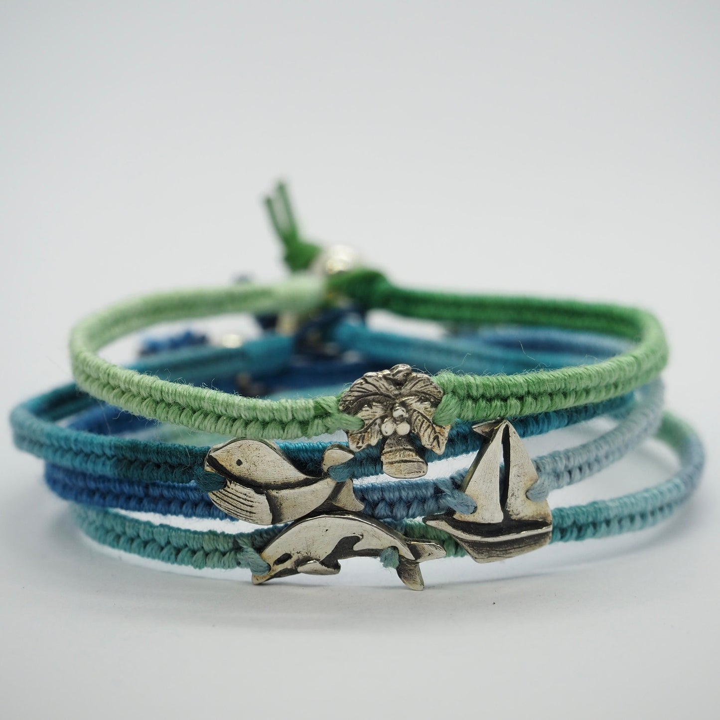 A lovely tiny unique fine silver sailing boat on a gorgeous soft blue leather, cotton and sterling silver friendship bracelet.