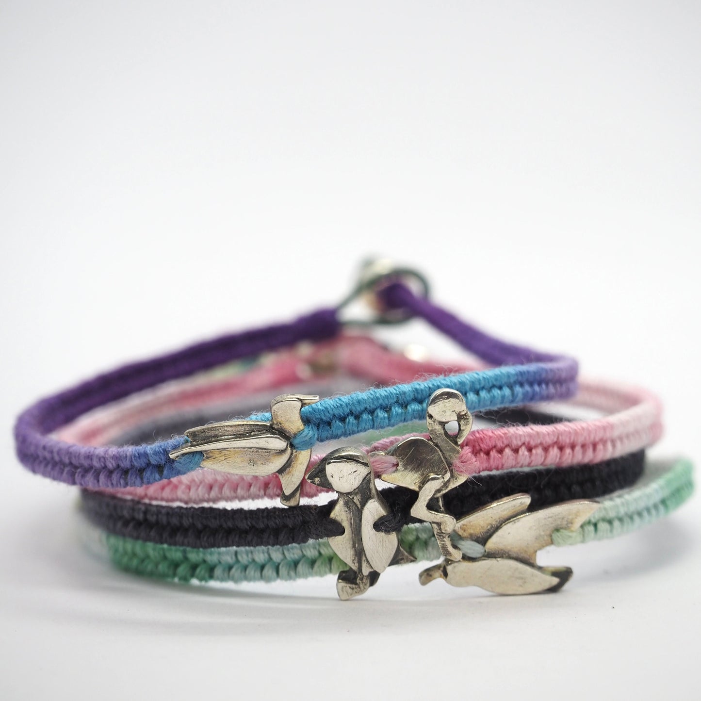 A gorgeous turquoise leather, cotton and sterling silver woven charm bracelet with a tiny unique fine silver seagull charm.