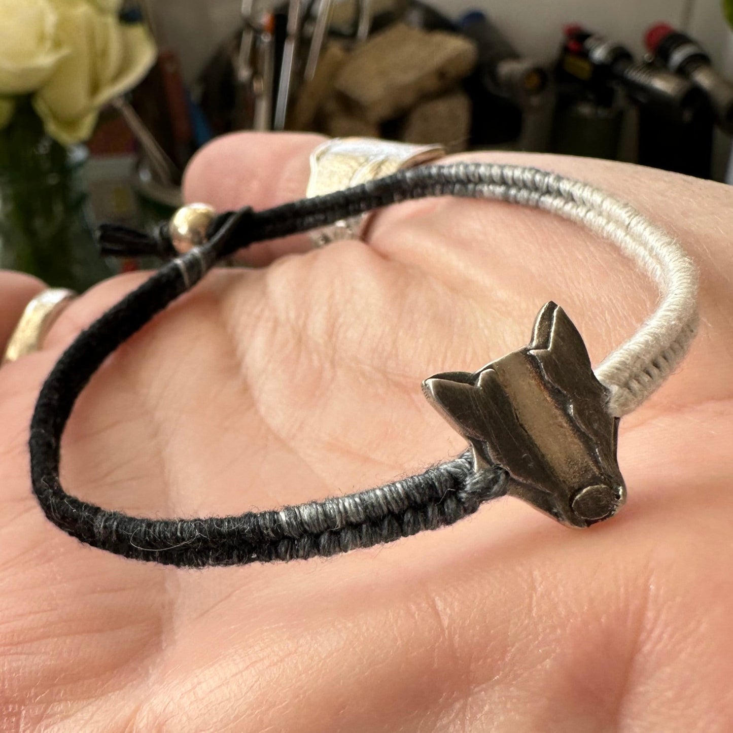 A lovely handmade fine silver badger on a soft black and grey leather, cotton friendship and sterling silver bracelet…
