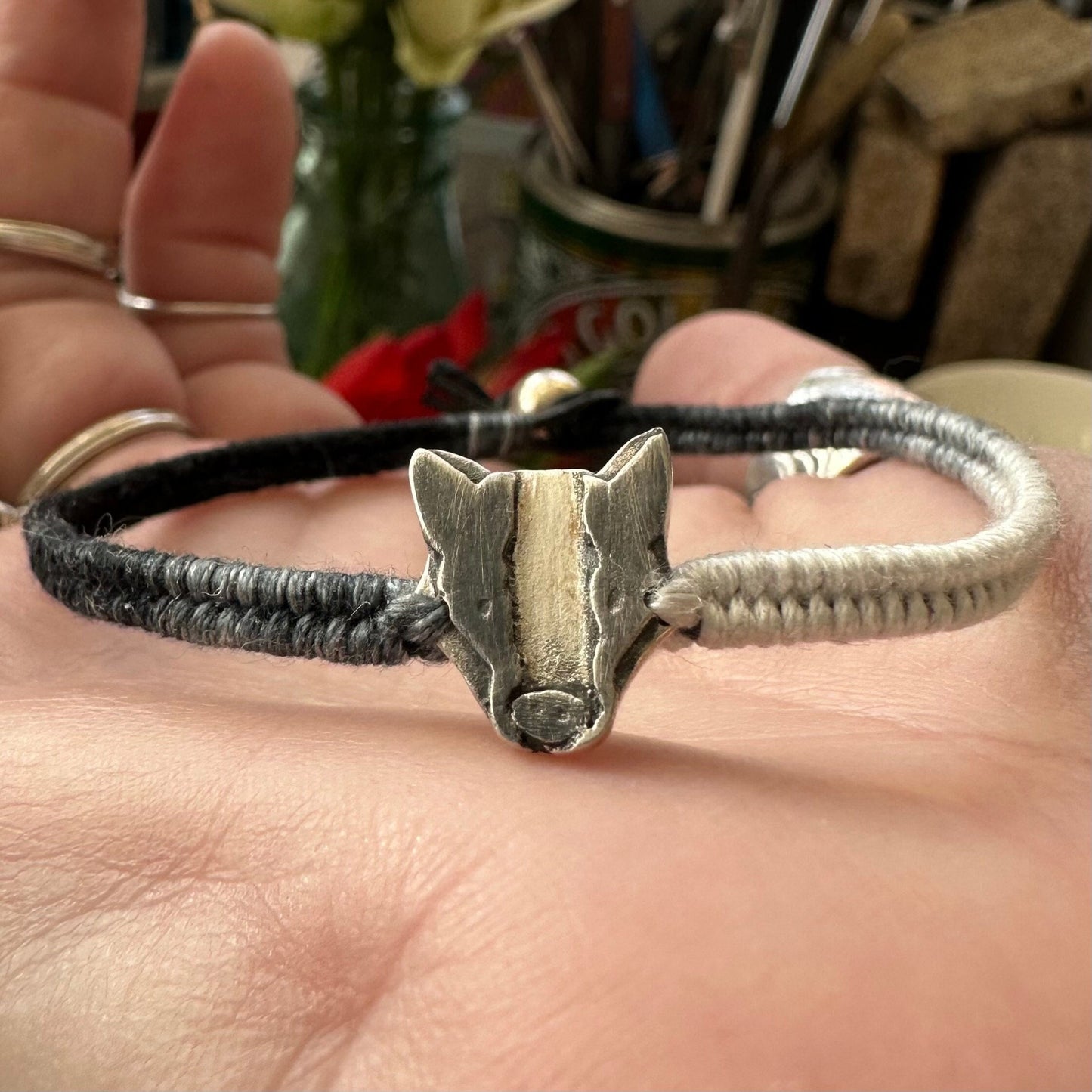A lovely handmade fine silver badger on a soft black and grey leather, cotton friendship and sterling silver bracelet…