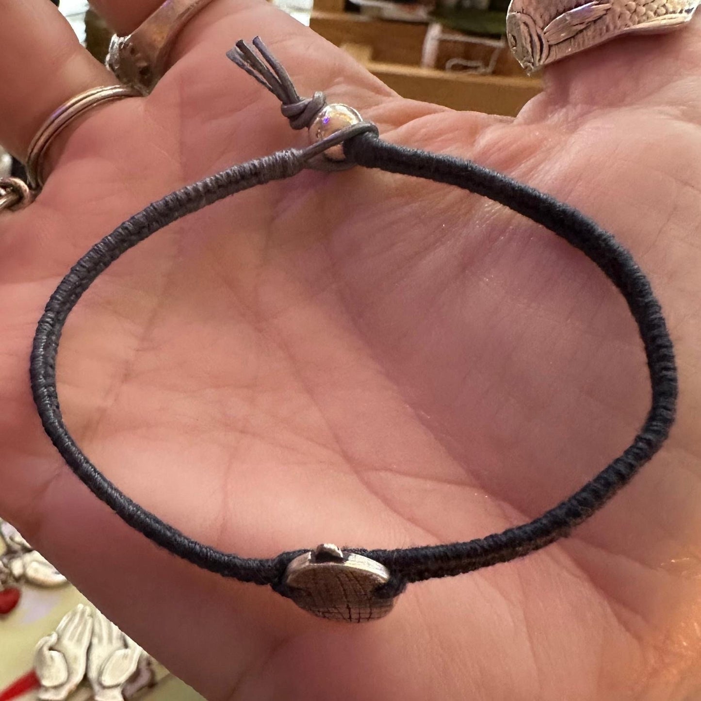 A gorgeous handmade fine silver disco ball charm on a lovely black and grey leather and cotton woven charm bracelet…