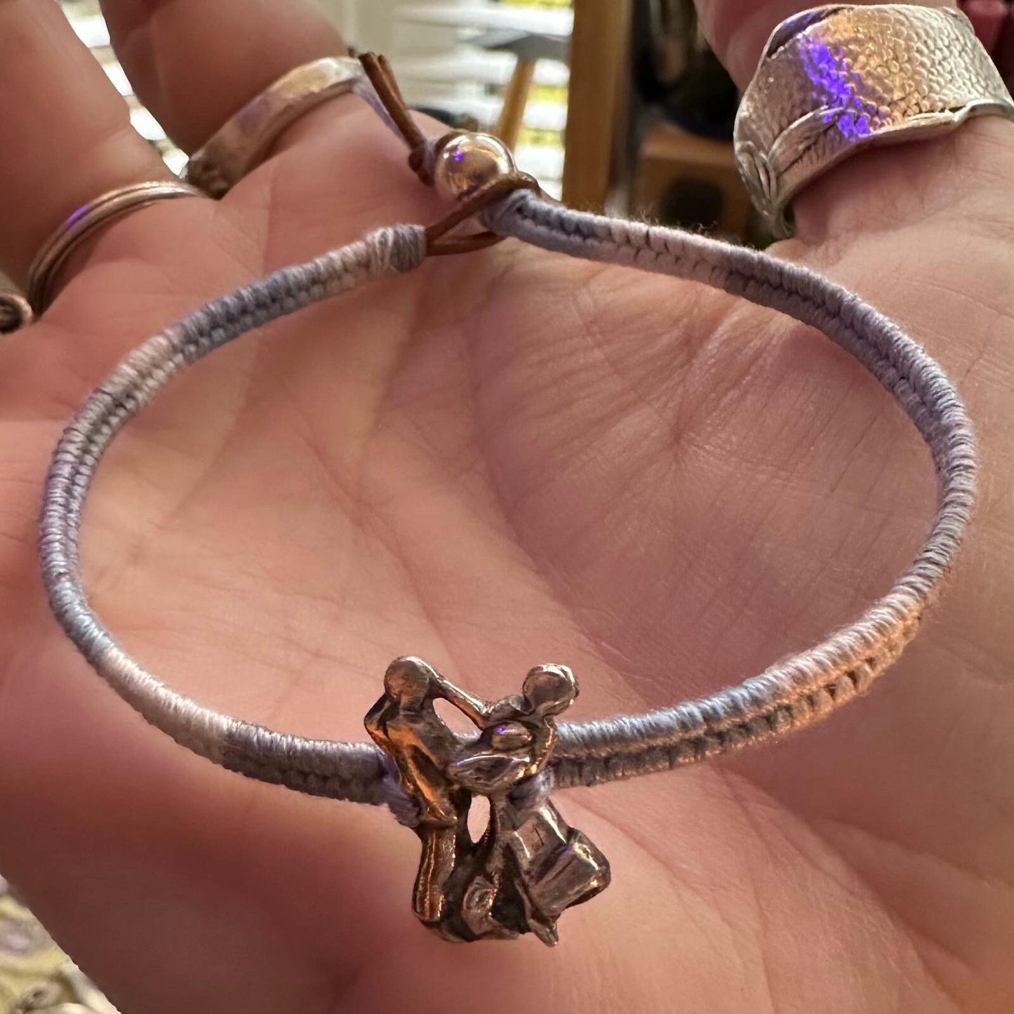 A lovely ballroom dancing couple handmade in fine silver on a soft grey/blue faded leather, cotton and sterling silver friendship bracelet.