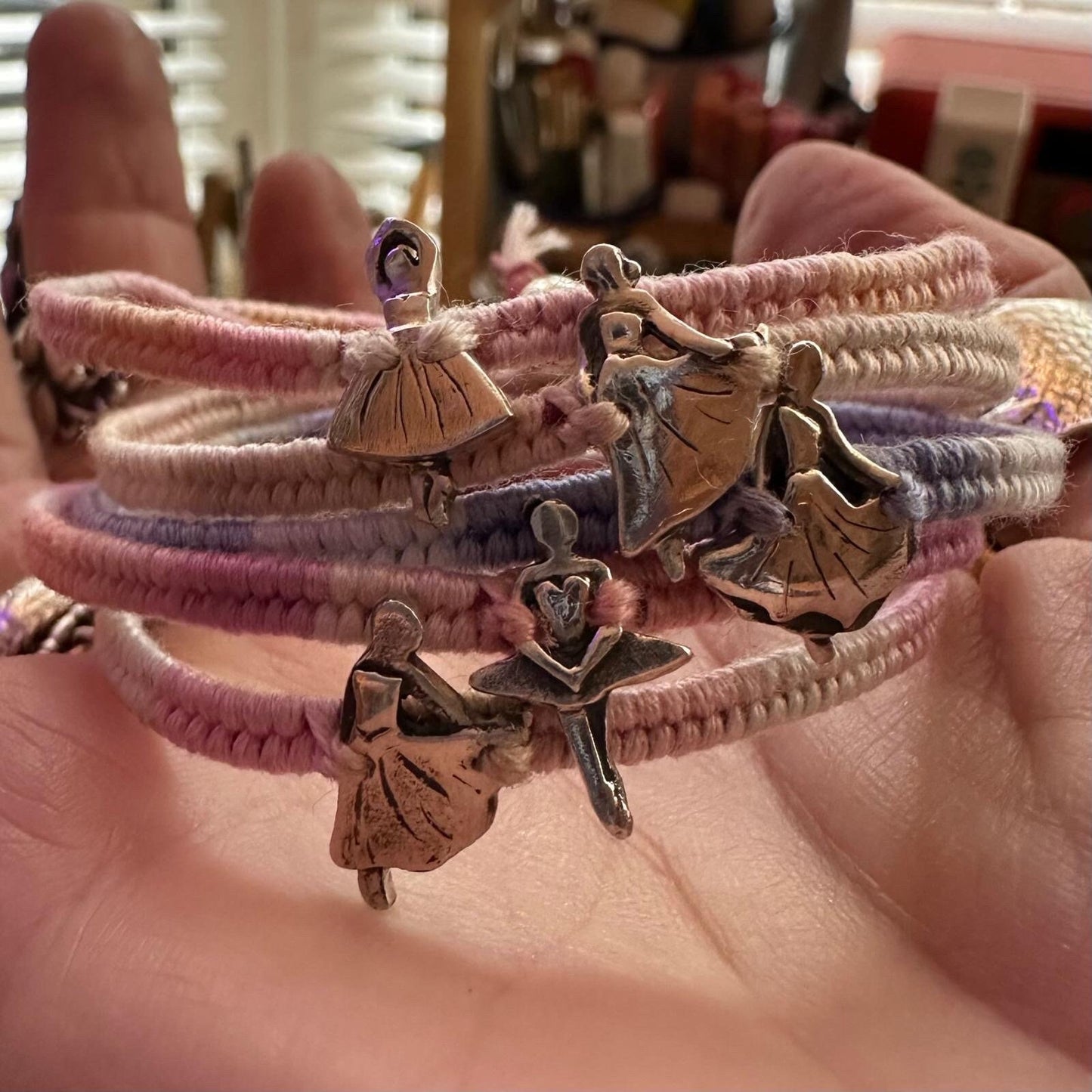 A beautiful tiny ballet dancer handmade in fine silver on a baby pinks leather, sterling silver and cotton woven charm bracelet…