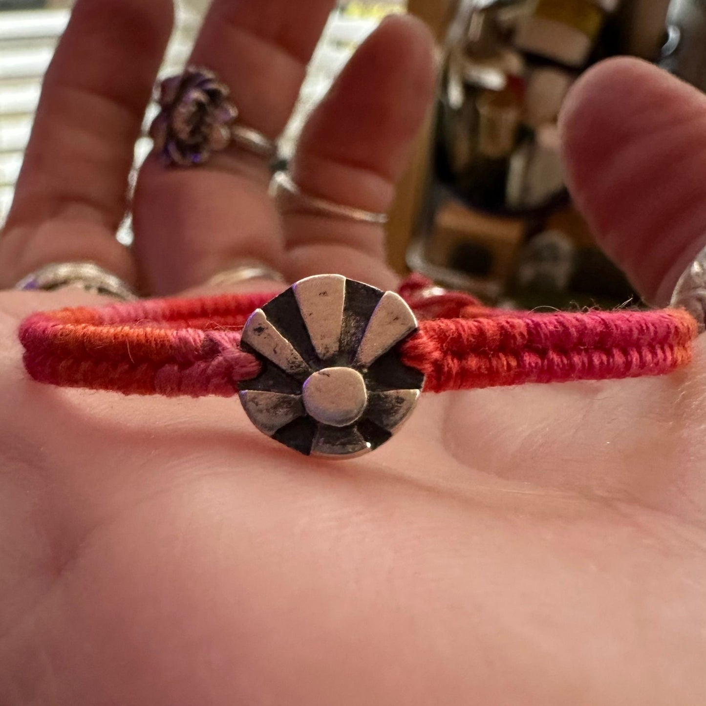 A lovely tiny handmade fine silver sun beams on pinky red leather, cotton and sterling silver friendship bracelet…