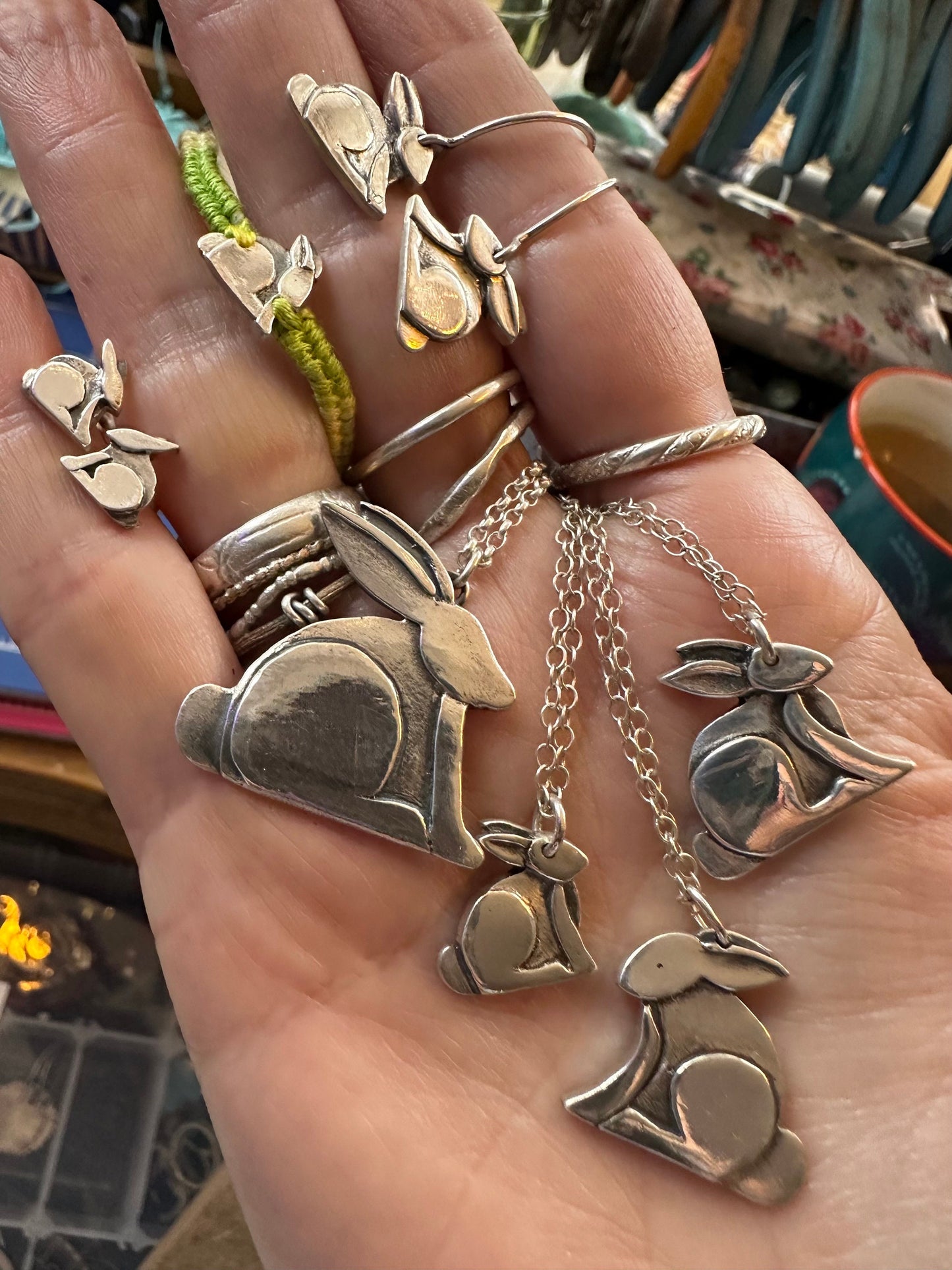 A lovely pair of tiny handmade fine silver rabbit stud earrings set on sterling silver pins.