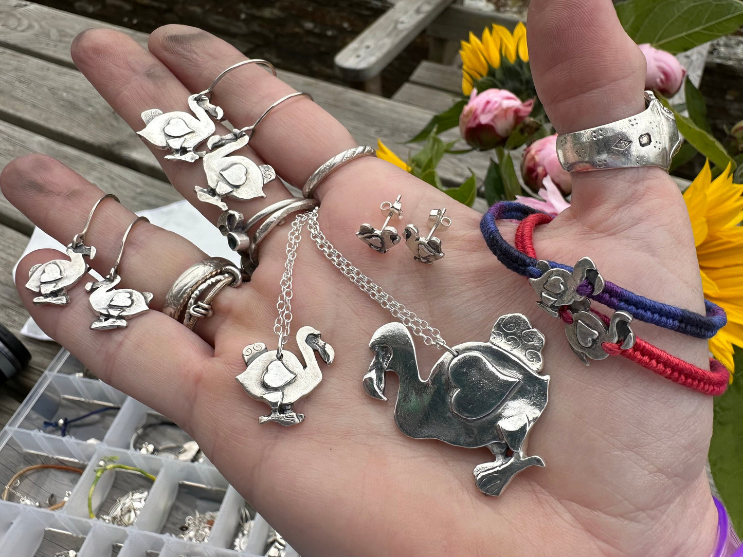 A gorgeously simple dodo pendant, handmade in fine silver and hung on a sterling silver chain.