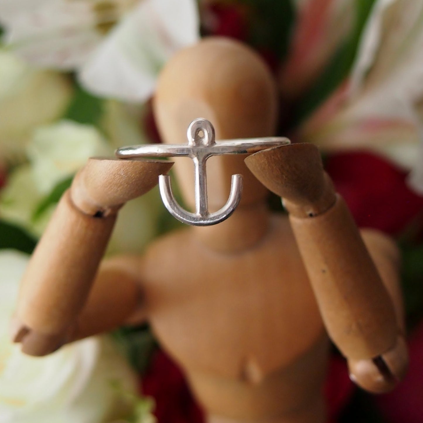 A cute little hand made anchor ring in sterling silver wire.